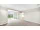 Spacious living room with neutral carpeting and sliding glass doors to the backyard at 16870 Imperial Ct, Fishers, IN 46040