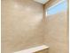 Shower with neutral tile and built-in bench at 16870 Imperial Ct, Fishers, IN 46040