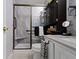 Stylish bathroom with a tiled shower featuring a glass door and modern fixtures at 17072 Newberry Ln, Westfield, IN 46074