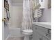 Bathroom features a shower-tub combination and a storage vanity with a neutral color scheme at 17072 Newberry Ln, Westfield, IN 46074