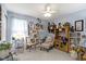 Comfortable bedroom with soft blue walls, decorative items and comfortable seating at 17072 Newberry Ln, Westfield, IN 46074