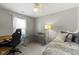Bright bedroom featuring a ceiling fan, desk area, and a window with natural light at 17072 Newberry Ln, Westfield, IN 46074