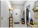 Bright entryway with tile flooring, coat rack and neutral decor creating a welcoming entrance to the home at 17072 Newberry Ln, Westfield, IN 46074