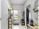 Bright foyer with tile flooring, coat rack, and neutral décor creating a welcoming entrance to the home at 17072 Newberry Ln, Westfield, IN 46074