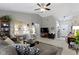 Cozy living room with modern decor, vaulted ceilings, and plush sectional with stylish accents at 17072 Newberry Ln, Westfield, IN 46074