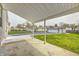 View of backyard with green space, concrete patio and detached garage at 2009 N Bosart Ave, Indianapolis, IN 46218