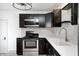 Well-designed kitchen with stainless steel appliances, modern cabinets, and light countertops at 2009 N Bosart Ave, Indianapolis, IN 46218