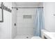 Updated shower featuring subway tile, a rainfall shower head, and modern fixtures at 2009 N Bosart Ave, Indianapolis, IN 46218