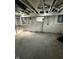 Unfinished basement with concrete floor and white painted block walls at 2115 N Leland Ave, Indianapolis, IN 46218