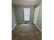 Bedroom with neutral carpet, gray walls, white trim, and a window with blinds at 2115 N Leland Ave, Indianapolis, IN 46218