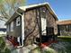 Charming home featuring brown siding, a white door, and updated trim at 2115 N Leland Ave, Indianapolis, IN 46218