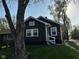 Charming single-story home with navy siding, white trim, and a well-maintained front yard at 2115 N Leland Ave, Indianapolis, IN 46218