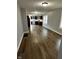 Bright living room featuring hardwood floors, neutral paint, and ample natural light at 2115 N Leland Ave, Indianapolis, IN 46218