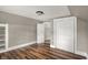 Bedroom with wood floors, and large closet at 221 N Munsie St, Indianapolis, IN 46229