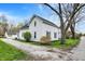 Charming two-story home with updated windows and a well-maintained gravel driveway at 221 N Munsie St, Indianapolis, IN 46229