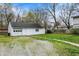 A detached garage with a gravel driveway at 221 N Munsie St, Indianapolis, IN 46229