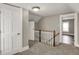 Upstairs hallway featuring stairs and access to other rooms at 221 N Munsie St, Indianapolis, IN 46229