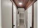 Hallway with beautiful wood ceiling, gray walls, and neutral carpet at 221 N Munsie St, Indianapolis, IN 46229
