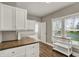 Bright kitchen featuring white cabinets, wood countertop, and stainless steel appliances at 221 N Munsie St, Indianapolis, IN 46229