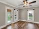 Elegant living room features hardwood floors, natural light, and a ceiling fan at 221 N Munsie St, Indianapolis, IN 46229