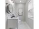 Stylish powder room with marble floors, modern vanity, and sleek fixtures at 2326 Guilford Ave, Indianapolis, IN 46205