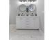 Bright bathroom featuring double sinks, marble floors, and modern fixtures at 2326 Guilford Ave, Indianapolis, IN 46205