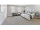 This bedroom features a bed, chairs, two windows, and carpet at 2326 Guilford Ave, Indianapolis, IN 46205