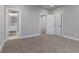 Neutral bedroom with new carpet, and doorway to the bathroom at 2326 Guilford Ave, Indianapolis, IN 46205