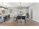 Open-concept dining room with modern lighting and dining table with seating for six at 2326 Guilford Ave, Indianapolis, IN 46205