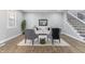 Open-concept living room featuring modern decor, a cozy seating area, and sleek hardwood floors at 2326 Guilford Ave, Indianapolis, IN 46205