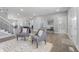 Open-concept living space with hardwood floors, a neutral color scheme, and views into other rooms at 2326 Guilford Ave, Indianapolis, IN 46205