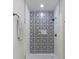 Luxurious shower with patterned tile and black fixtures at 2326 Guilford Ave, Indianapolis, IN 46205