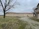 Large barn with neutral color tones, seen from the exterior with an open field at 2365 E 850 N, Lebanon, IN 46052