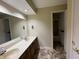 Bathroom featuring double sink vanity, large mirror, and neutral tones at 2365 E 850 N, Lebanon, IN 46052