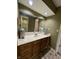 Bathroom featuring single sink vanity, large mirror, and neutral tones at 2365 E 850 N, Lebanon, IN 46052