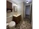 Bathroom featuring a toilet, vanity, and mirror with neutral color tones at 2365 E 850 N, Lebanon, IN 46052