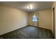 Bedroom with green carpet, wallpapered walls, and natural light from the window at 2365 E 850 N, Lebanon, IN 46052