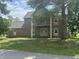 Traditional brick home with a balcony and a well-manicured lawn at 2365 E 850 N, Lebanon, IN 46052