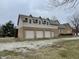 Three-car garage attached to the house with brick and vinyl exterior at 2365 E 850 N, Lebanon, IN 46052