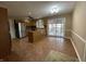 Open kitchen area featuring stainless steel appliances, tile floors, lots of cabinets and sliding glass doors to the backyard at 2365 E 850 N, Lebanon, IN 46052