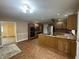 Spacious eat-in kitchen featuring light oak cabinets, tile flooring, stainless steel appliances, and a ceiling fan at 2365 E 850 N, Lebanon, IN 46052