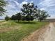 Large lawn with scattered mature shade trees on a sunny day at 2365 E 850 N, Lebanon, IN 46052