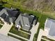 Aerial view showcasing homes with manicured lawns, mature trees and neighborhood landscaping at 2798 W High Grove Cir, Zionsville, IN 46077