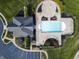 Birds-eye view of community pool with many lounge chairs, landscaped surroundings, and a nearby parking area at 2798 W High Grove Cir, Zionsville, IN 46077