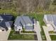 Aerial view showcasing a home with large backyard and a basketball hoop next to the driveway at 2798 W High Grove Cir, Zionsville, IN 46077