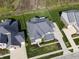 Aerial view showcasing homes with manicured lawns, mature trees and neighborhood landscaping at 2798 W High Grove Cir, Zionsville, IN 46077