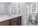 Bright bathroom featuring a modern vanity, updated fixtures and a walk-in shower at 2798 W High Grove Cir, Zionsville, IN 46077