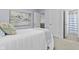 Light-filled bedroom showcasing the calming decor and connecting en-suite bathroom at 2798 W High Grove Cir, Zionsville, IN 46077