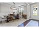 Elegant dining room featuring stylish light fixture, and large windows at 2798 W High Grove Cir, Zionsville, IN 46077