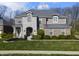 Charming two-story home with a stone facade, well-manicured lawn, and beautiful landscaping at 2798 W High Grove Cir, Zionsville, IN 46077